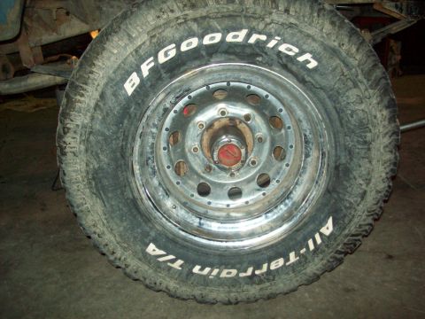 1971 Ford F-100 - Close-up of a BFGoodrich All-Terrain T/A tire and steel wheel.