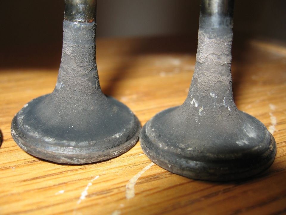Close-up of two engine valves with carbon buildup