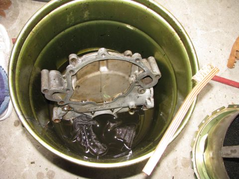 1986 Ford Bronco - soaking cover in solvent to help get it clean.
