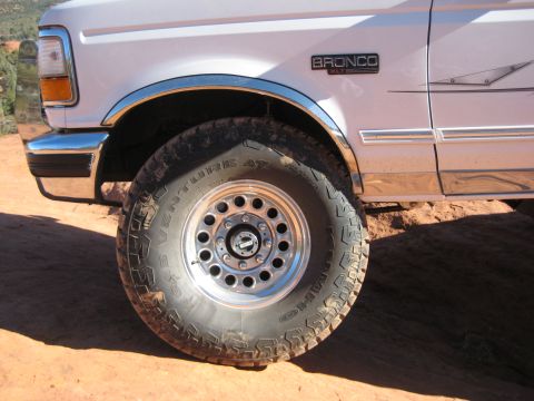 1996 Ford Bronco - Close-up of a 1996 Ford Bronco XLT's front fender and wheel, showing off-road tire.