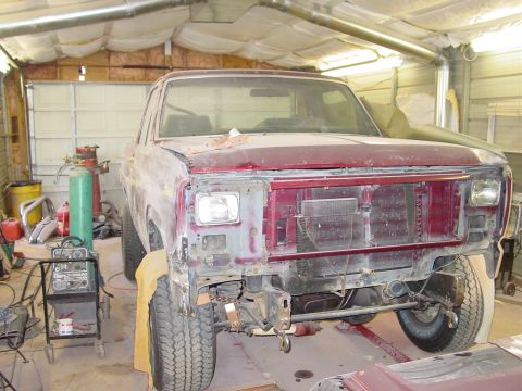 1984 Ford Bronco - This Ford Bronco appears to be from the early 1980s, not a 1984 model, as it undergoes bodywork in a garage.
