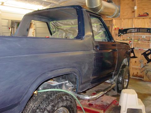 1984 Ford Bronco - Ford Bronco body undergoing preparation for paint in a workshop setting.
