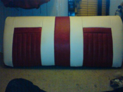 1989 Ford Bronco - A two-tone car seat with red and white upholstery is shown.