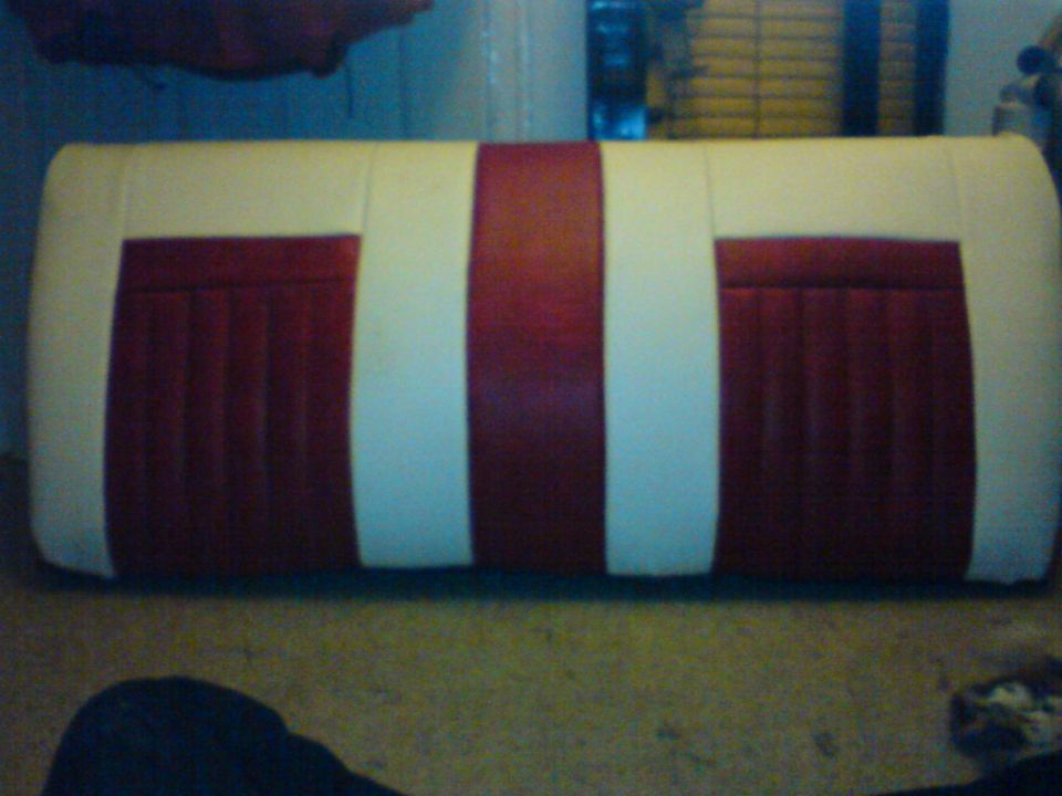 Red and white striped car seat with vertical pleats on red sections