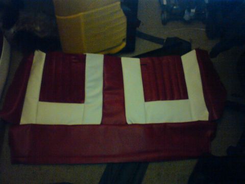 1989 Ford Bronco - Close-up of red and white car seat upholstery, likely for a vintage vehicle.