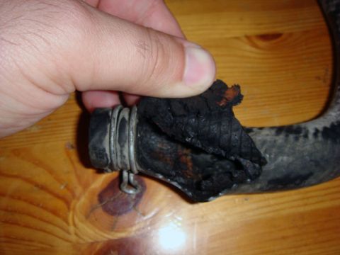 2000 Mitsubishi Montero - A damaged heater hose is shown, indicating a potential issue with the vehicle's heating system.