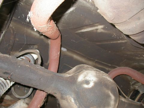 1968 Mercury Cougar - Close-up of the underbody, showing exhaust system components and the rear differential housing.