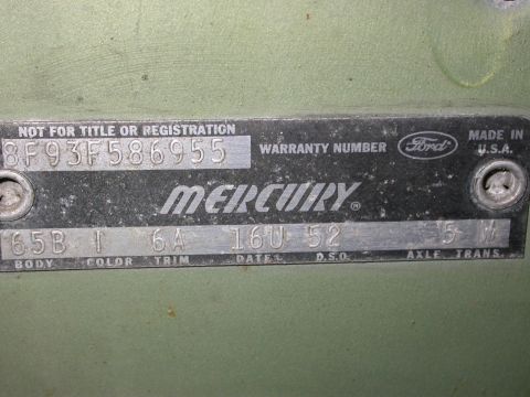 1968 Mercury Cougar - A close-up of a vehicle's identification plate, showing manufacturing details and codes.