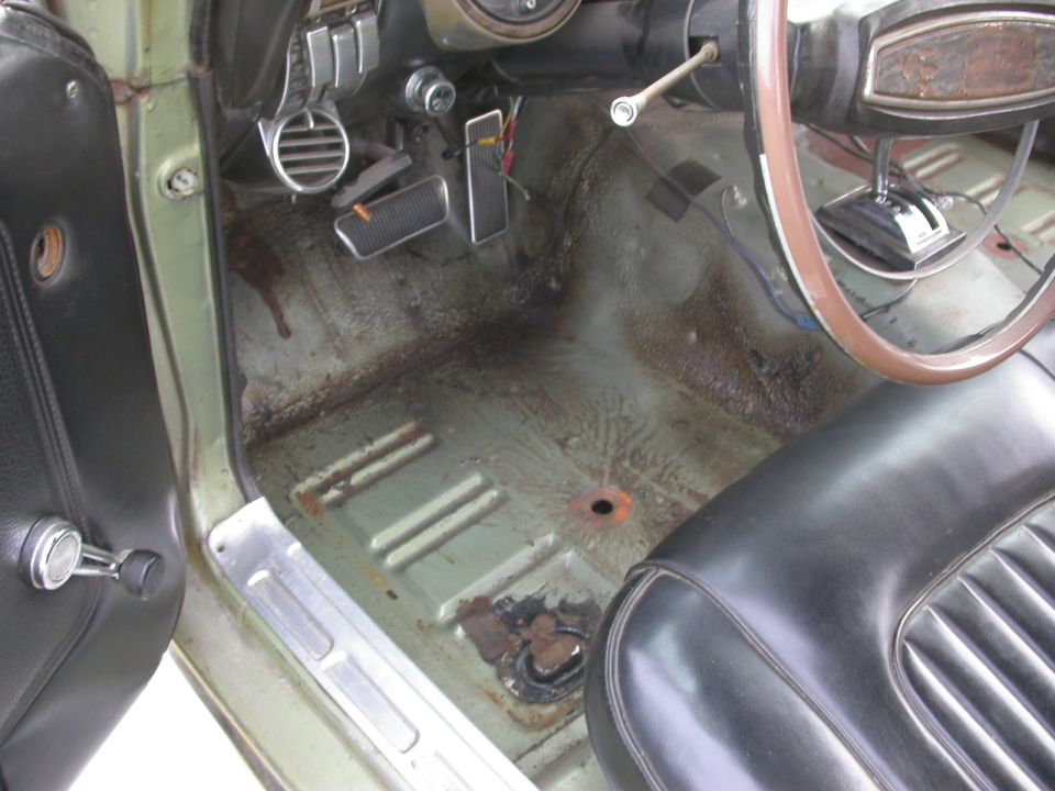 1968 Mercury Cougar interior showing worn floor, pedals, and driver's seat