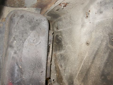 1968 Mercury Cougar - Detail of an underbody component, showing mounting hardware and the textured metal surface.