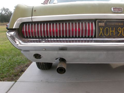 1968 Mercury Cougar - Rear view of a 1968 Mercury Cougar showing its distinctive taillights and chrome bumper.