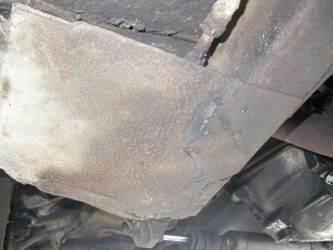 1968 Mercury Cougar - Underside view of vehicle frame and suspension components, showing rust and wear.