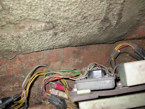 1968 Mercury Cougar - A tangle of wires and electrical components are visible in this close-up shot of a vehicle's interior.