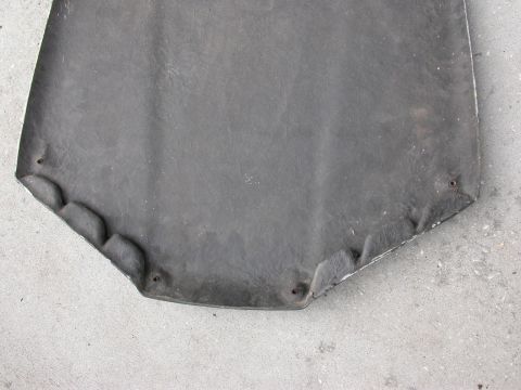 1968 Mercury Cougar - The underside of a car hood is shown, with mounting points and a textured surface visible.