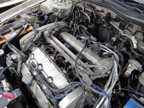 1993 Ford Taurus - The engine compartment is shown with various hoses, wires, and engine components visible.