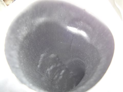 1993 Ford Taurus - The interior of a pipe or tube shows some residue and a crack.