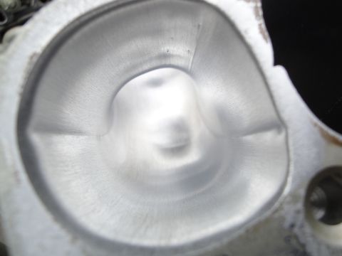 1993 Ford Taurus - Machined aluminum intake port on a cylinder head, showing fine machining lines.