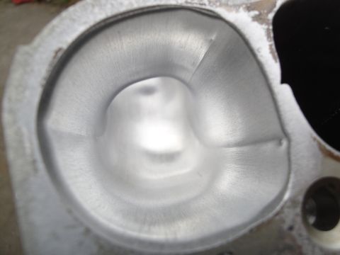 1993 Ford Taurus - The smooth, machined surface of an engine's cylinder head port is visible in this close-up shot.