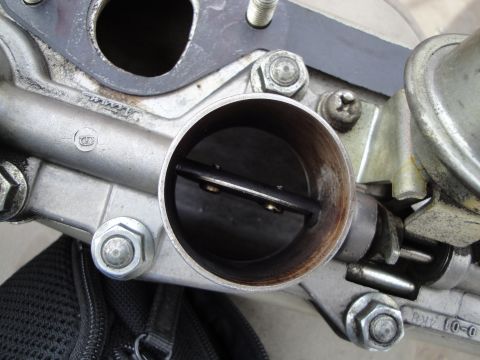 1993 Ford Taurus - Throttle body assembly showing internal components and mounting hardware.