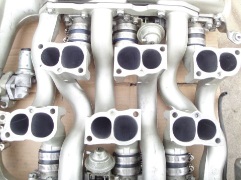 1993 Ford Taurus - Intake manifold with six ports and associated vacuum lines and sensors.