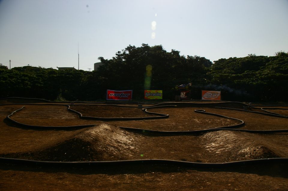 RC car track with jumps and banners in background