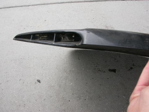 1968 Mercury Cougar - A black automotive part with visible internal structure is shown on a concrete surface.