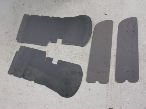 1968 Mercury Cougar - These appear to be custom-cut floor mats for a vehicle, laid out on a gray concrete floor.
