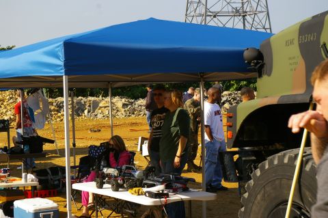 1986 Ford Bronco - A military truck with camouflage paint and visible markings is parked outdoors.