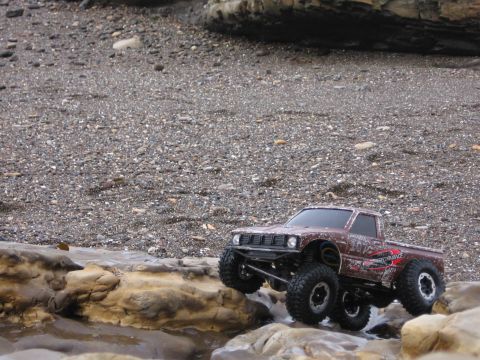 1993 Toyota 4Runner - This remote control truck navigates a rocky shoreline, its off-road capabilities.