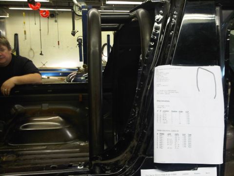 1996 Ford Bronco - A document with installation instructions is attached to the interior door frame of a vehicle.
