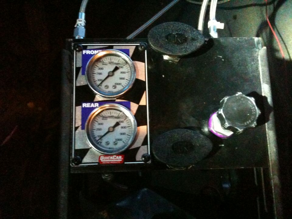 QuickCar front and rear brake pressure gauge panel beside master cylinder reservoirs