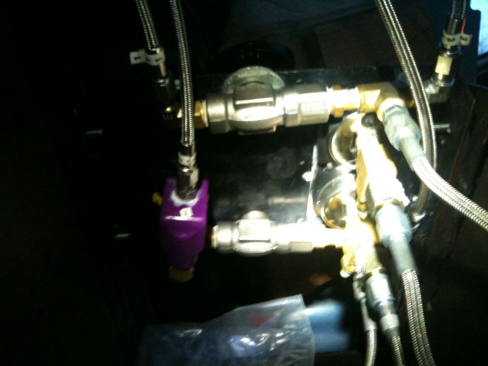 Metal manifold with braided steel hoses, brass and purple anodized fittings