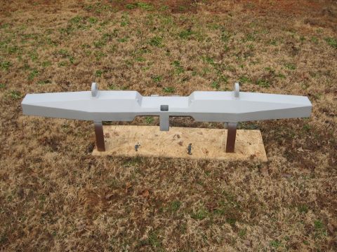 1995 Ford F-150 - Aftermarket truck bumper with tow hooks, displayed outdoors on plywood.