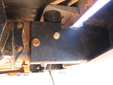 1995 Ford F-150 - Underneath view of a 1995 Ford F-150 frame, showing structural components and some rust.