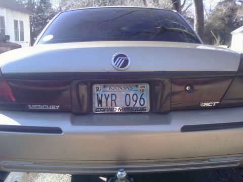 2000 Mercury Grand Marquis - The rear of a silver 2000 Mercury Grand Marquis is shown, with a Kansas license plate.
