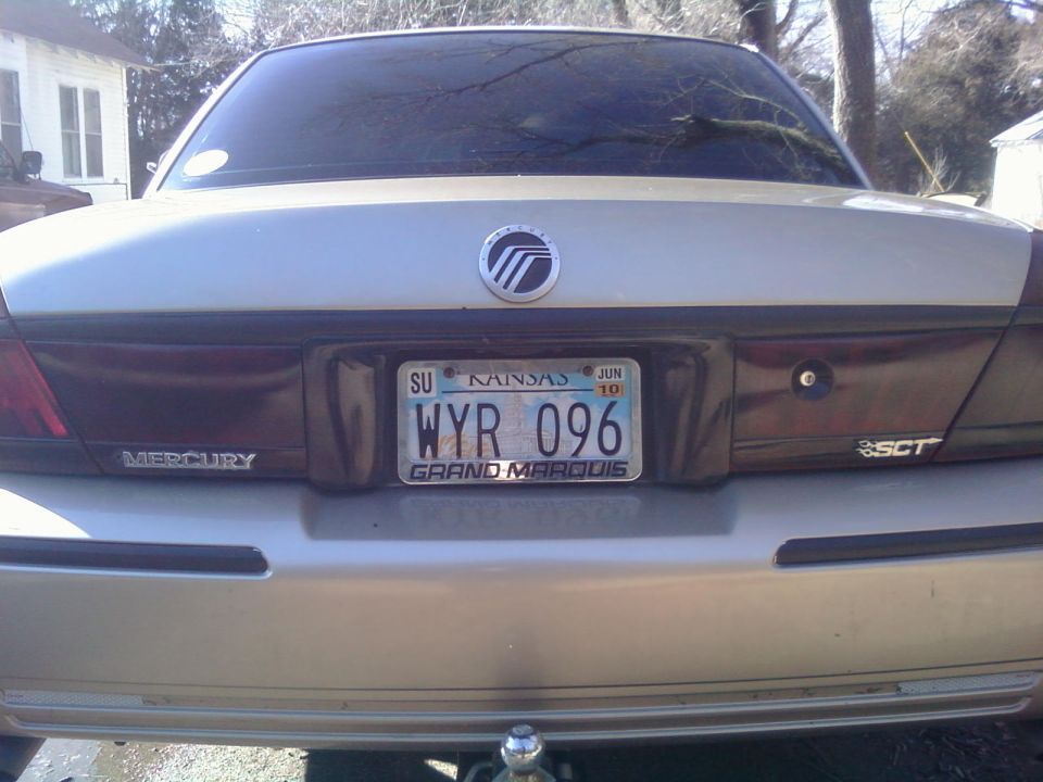 Silver 2000 Mercury Grand Marquis rear view, showing license plate WYR 096 from Kansas