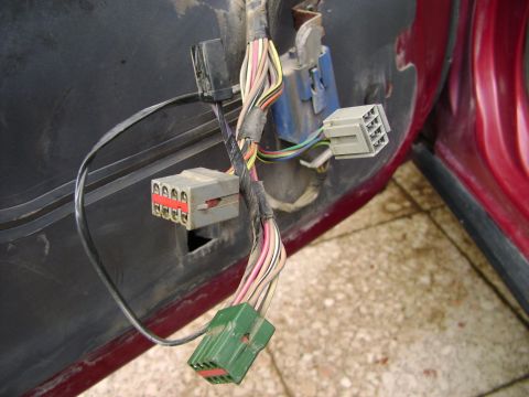 1998 Ford Crown Victoria - Close-up of a vehicle's interior wiring harness, showing various connectors and wires.
