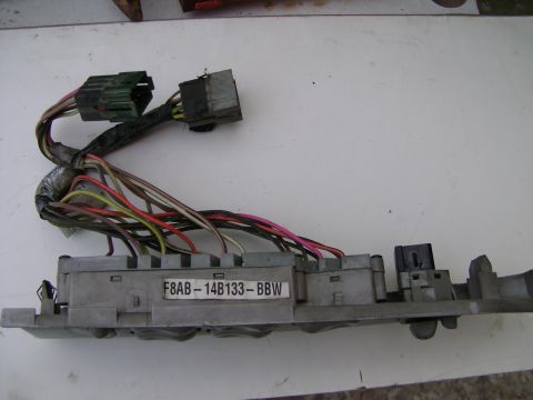 1998 Ford Crown Victoria - Close-up of an automotive fuse box and its associated wiring harness, displaying the part number F8AB-14B133-BBW.