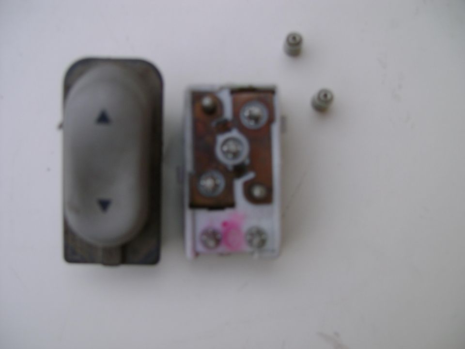 Car window switch and its internal mechanism with two small screws