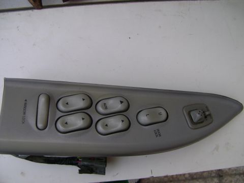 1998 Ford Crown Victoria - Close-up of a car's interior door panel, showing window and lock controls.