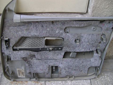 1998 Ford Crown Victoria - Interior view of a car door panel, showing insulation and internal components.