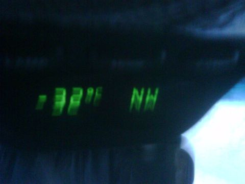 1996 Ford Bronco - Interior digital display shows -32 degrees and NW compass direction.