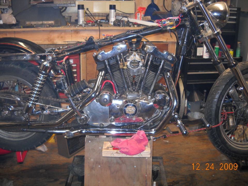 Motorcycle engine and frame in a workshop, 12.24.2009