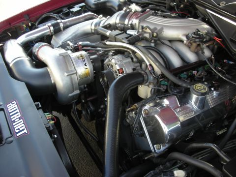 1992 Ford Crown Victoria - Close-up of a modified V8 engine a Novi supercharger and polished components.