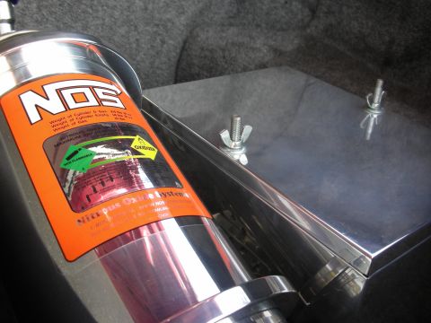 1992 Ford Crown Victoria - NOS nitrous oxide system tank with orange label detailing weight and gas specifications.