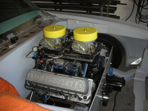 1992 Ford Crown Victoria - A custom engine build features dual carburetors and Oldsmobile valve covers, likely for a performance application.