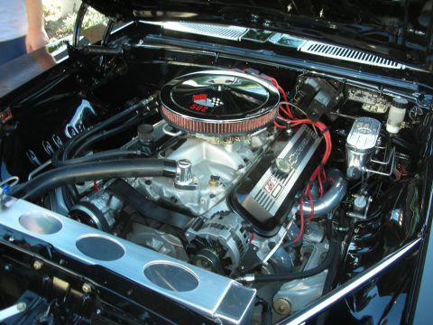 1992 Ford Crown Victoria - Detailed engine bay showing a Chevrolet 502 big-block crate engine with a polished chrome air cleaner bearing a red '502' crossed-flags emb…