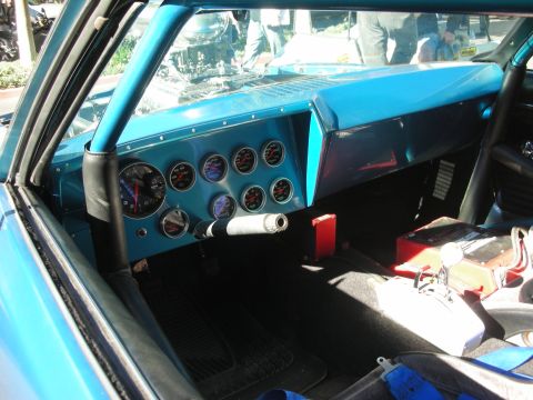 1992 Ford Crown Victoria - The interior features a custom blue dashboard with numerous gauges and a racing-style shifter, indicating a modified vehicle.