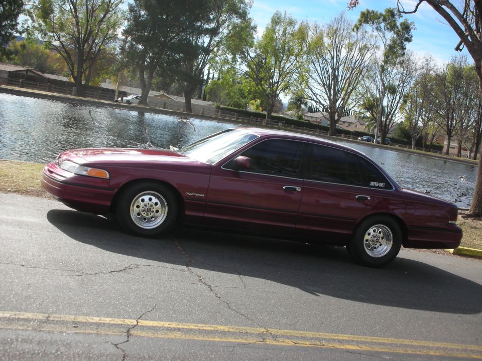 Maroon 1992 Ford Crown Victoria sedan, side view