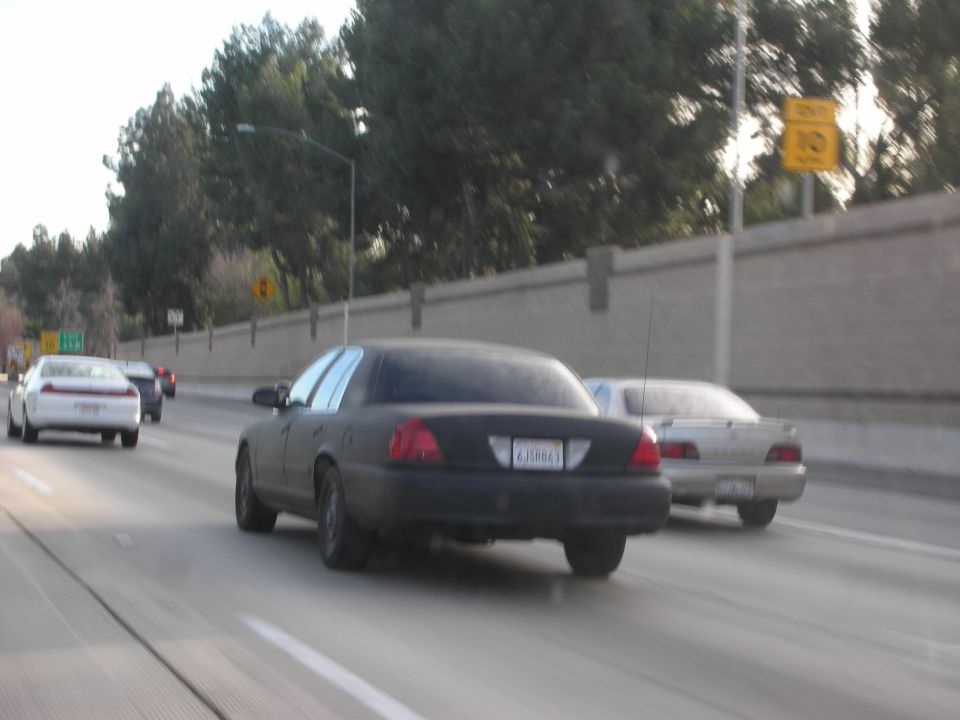 Rear view of black 1992 Ford Crown Victoria on highway